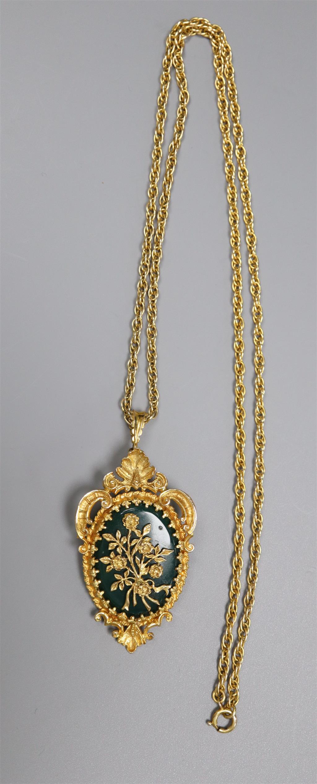 A 1970s 9ct gold and chrysophase set oval flower and scroll pendant brooch, on a multi-link 9ct chain,
